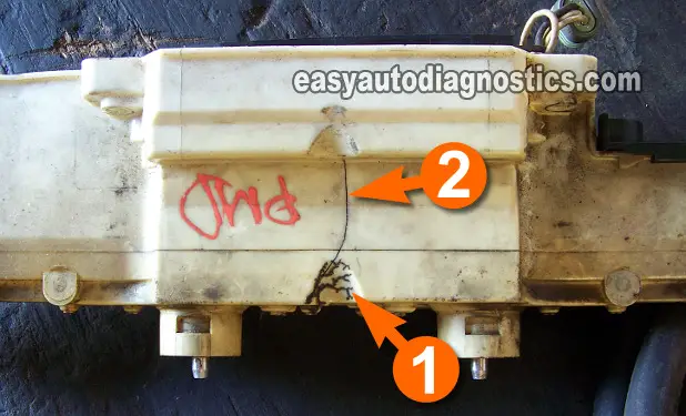 Example Of Carbon Tracks And Crack On The Ignition Coil Cover. How To Test The Ignition Coils (GM 2.4L Quad 4)