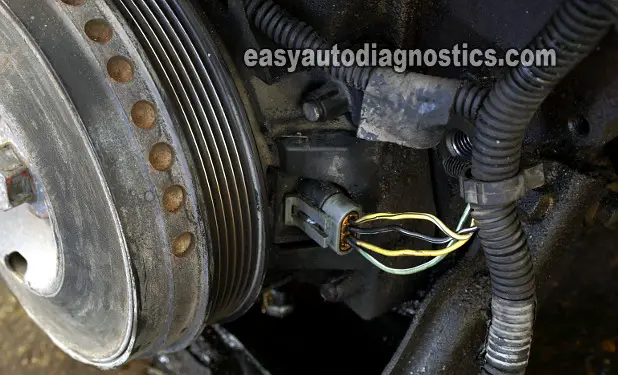 This crankshaft position sensor belongs to a 98 Olds Intrigue. This sensor is located behind the crankshaft pulley.