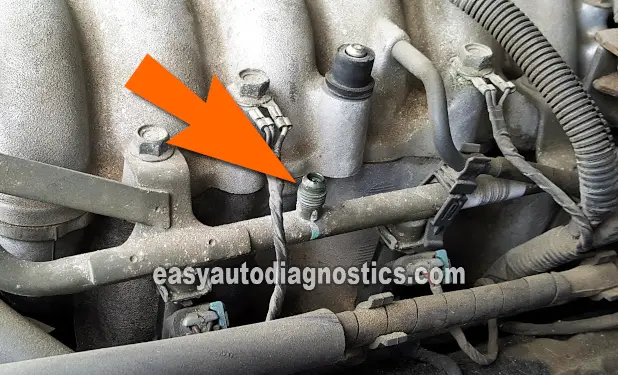 Location Of The Schrader Valve. How To Test The Fuel Pump (1998, 1999, 2000, 2001, 2002, 2003, 2004 3.2L V6 Isuzu Amigo, Rodeo and 3.2L Honda Passport)