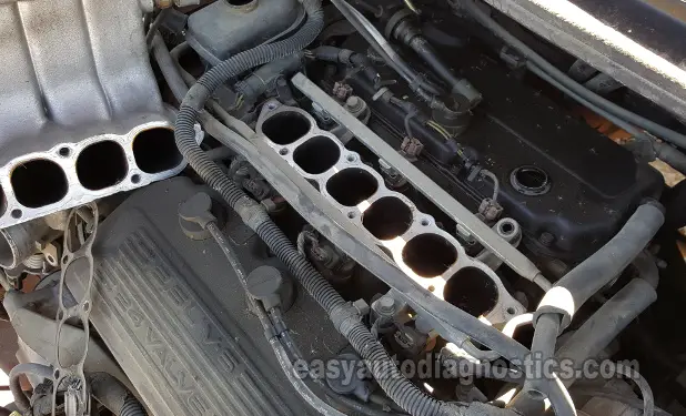 Intake Plenum Removed And Exposing The Intake Ports. How To Test The Fuel Injectors (2.5L V6 Chrysler/Dodge)