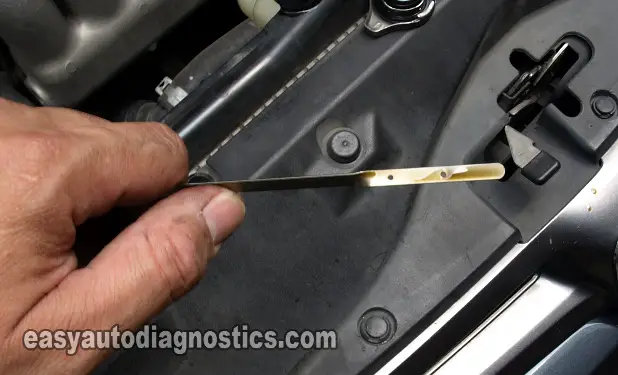 Checking The Color Of The Engine Oil On The Dipstick. How To Test A Blown Head Gasket (2002, 2003, 2004, 2005 2.4L Honda CR-V)